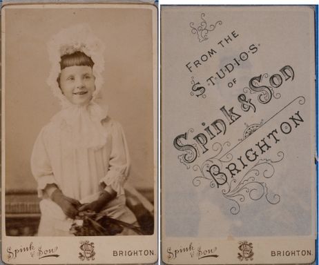 Carte-de-Visite, with its protective tissue, of a young girl looking very happy