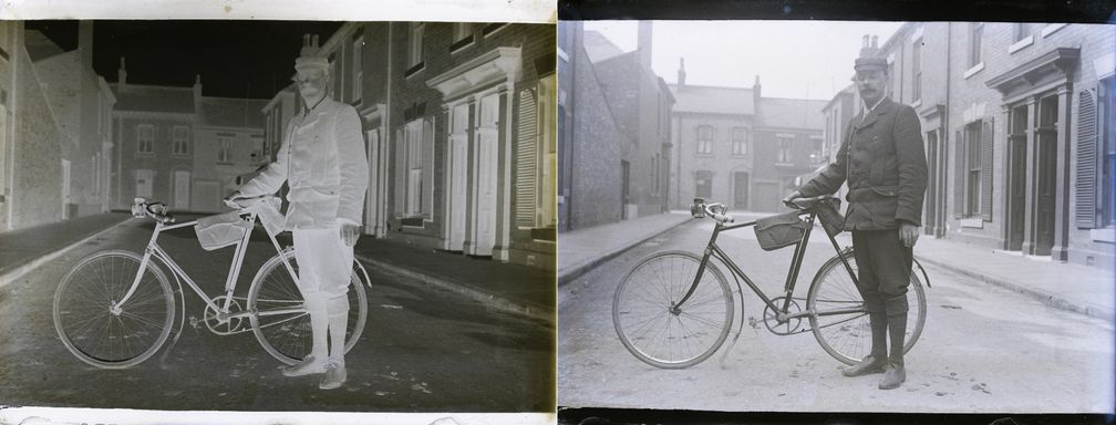 A glass plate negative and its image of a man in a cap and suit with a bicycle in a city street.