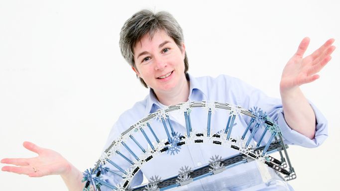 Ann with a K'NEX bridge