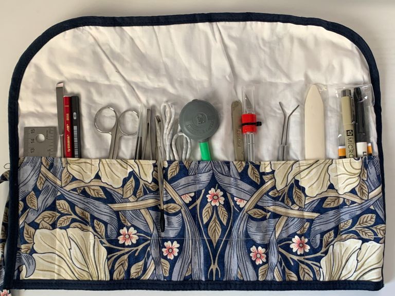 A tool roll containing a selection of tools